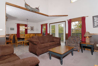 Pigeon Forge Chalet with Comfortable Microfiber Livingroom area with a Flat Screen TV and a Gas Fireplace for great Vacation Entertainment