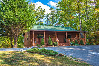 Pigeon Forge Secluded Two Bedroom Cabin Rental that features a Hot Tub, Mountain View, and Foosball Table