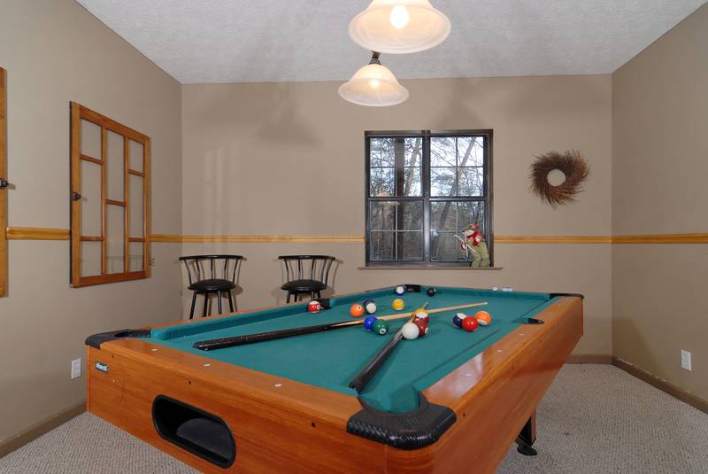 pigeon forge cabin gameroom with a pool table