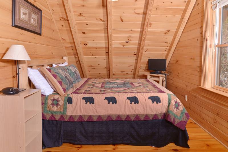 Pigeon Forge Cabin Queen Size Bed in the Bedroom with Flat Screen Television