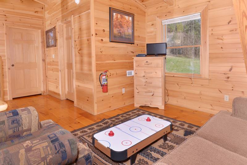 Pigeon Forge Cabin with a Lofted seating area with a miniature Air Hockey Table