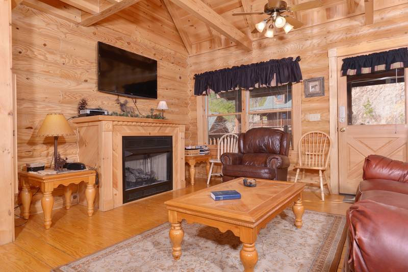 Pigeon Forge Cabin with a Flat Screen Television with a Gas Fireplace