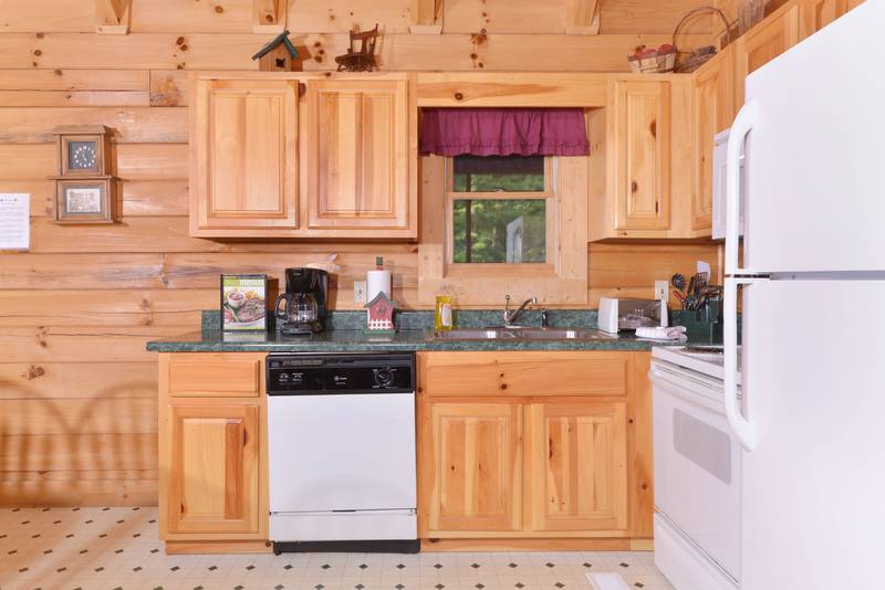 Pigeon Forge Two Bedroom cabin that features a fully equipped kitchen that leads into the living room area
