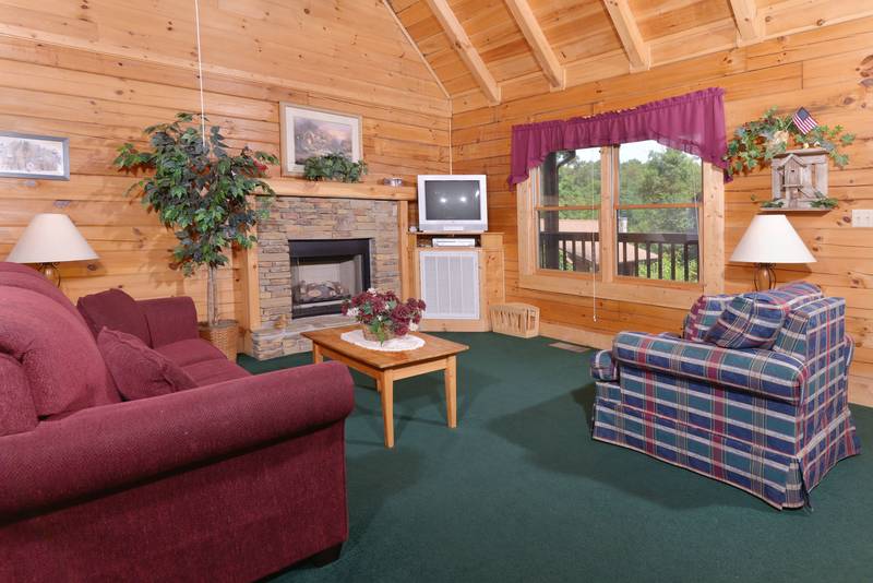 Two Bedroom Pigeon Forge Cabin featuring a gas fireplace in the livingroom