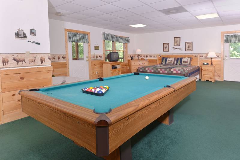 Pigeon Forge Two Bedroom Cabin Featuring a Pool Table in the Master Suite