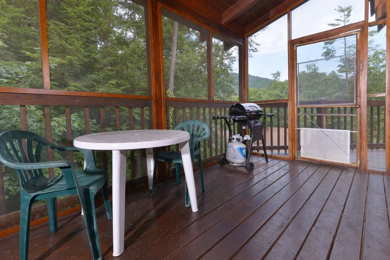 Pigeon Forge Two Bedroom Cabin that features a gas grill