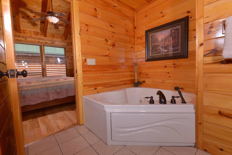 Pigeon Forge Cabin Rental that features a Whirl Pool in the Master Suite
