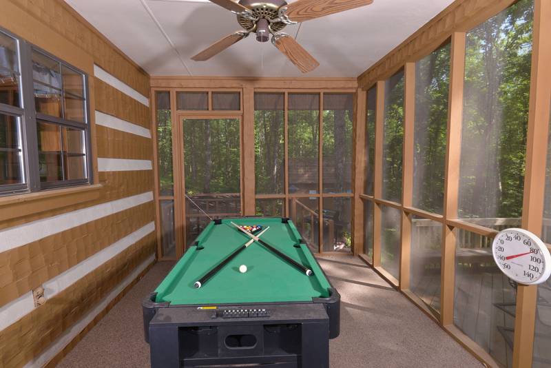 Pigeon Forge Cabin Rental Pool Table on the Screened in Porch Area