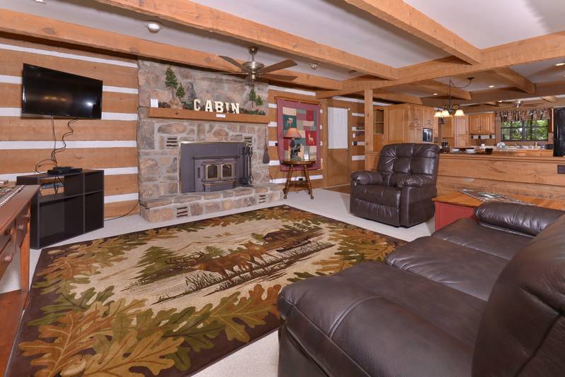 Pigeon Forge Cabin Rental that features a woodburning fireplace