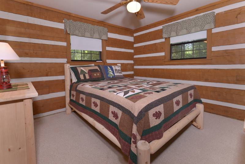 Queen Size Bed in the Second Bedroom in this Pigeon Forge Cabin Rental