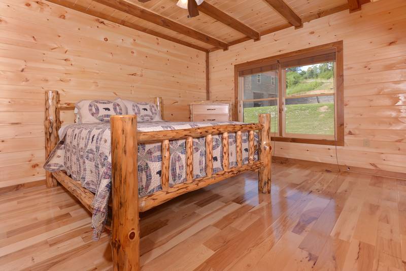 This Pigeon Forge Vacation Cabin Rental features 2 bedrooms on the main level