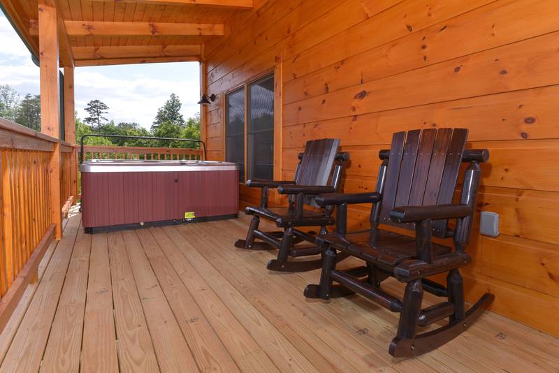 This Pigeon Forge Cabin Offers an Outdoor Hot Tub and Rockers