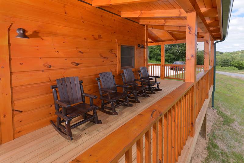 Pigeon Forge Cabin Rental Outdoor Covered Deck Area that features rockers