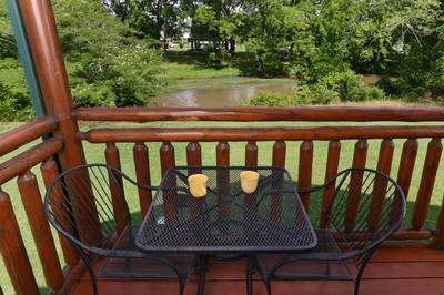 River Cabin back deck with table and chairs