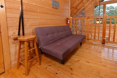 River Cabin upper level open loft with futon