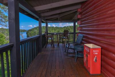 Smoke on the Water wraparound covered deck with high top table and chairs