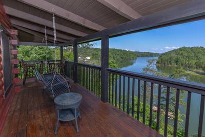 Smoke on the Water wraparound covered deck with swing