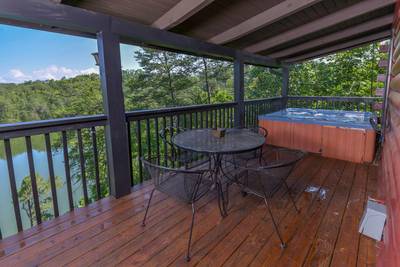 Smoke on the Water wraparound covered deck with hot tub