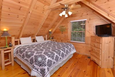 A Smoky Getaway upper level bedroom two with king size bed
