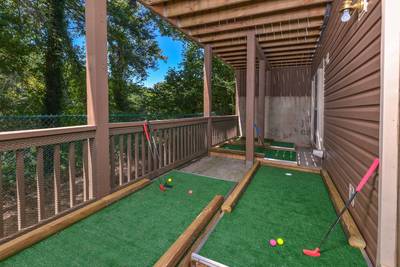 Striking Waters lower level covered deck with putt putt course