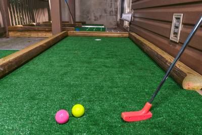 Striking Waters lower level covered deck with putt putt course