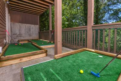 Striking Waters lower level covered deck with putt putt course