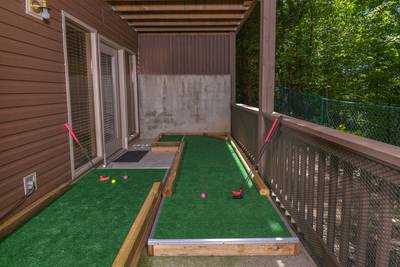 Striking Waters lower level covered deck with putt putt course