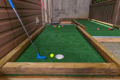 Striking Waters lower level covered deck with putt putt course