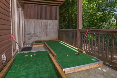 Striking Waters lower level covered deck with putt putt course