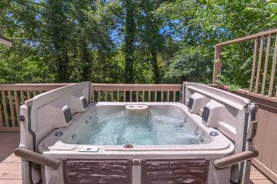 Striking Waters main level back deck with hot tub