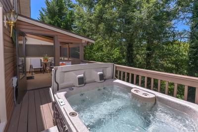 Striking Waters main level back deck with hot tub