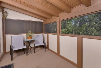 Striking Waters main level screened in back deck