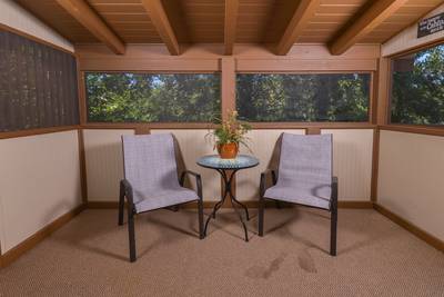 Striking Waters main level screened in back deck