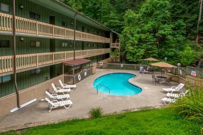Rustic River outdoor swimming pool at Village Stream Condos