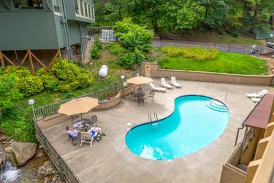 Rustic River outdoor swimming pool at Village Stream Condominiums