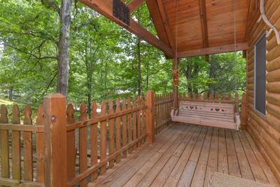 Allen's Hideaway covered entry deck with swing