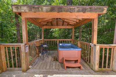 Allen's Hideaway hot tub on covered side deck