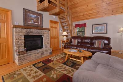 Allen's Hideaway living room with stone encased gas fireplace