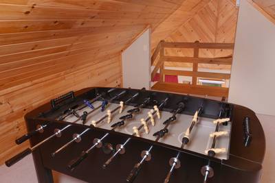 Allen's Hideaway upper level loft area with foosball table