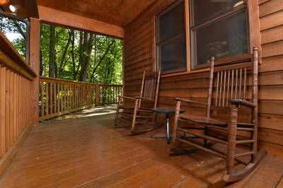 Deer to Dream main level covered entry deck with rocking chairs