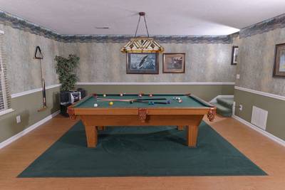 Whispering River lower level game room with pool table