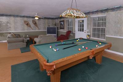 Whispering River lower level game room with pool table
