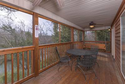 Whispering River main level screened in back deck