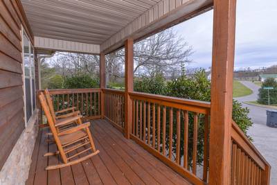 Whispering River main level covered entry deck