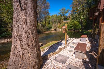 Crystal Waters concrete benches on the shore of the Little Pigeon River