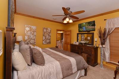Crystal Waters main level bedroom one with 36-inch flat screen TV