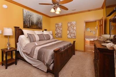 Crystal Waters main level bedroom one with adjustable king size bed
