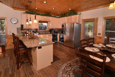 Crystal Waters fully furnished kitchen with stainless steel appliances