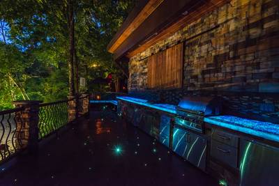 Crystal Waters main level outdoor kitchen with glowing countertops