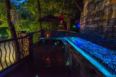 Crystal Waters main level outdoor patio with glowing concrete beches